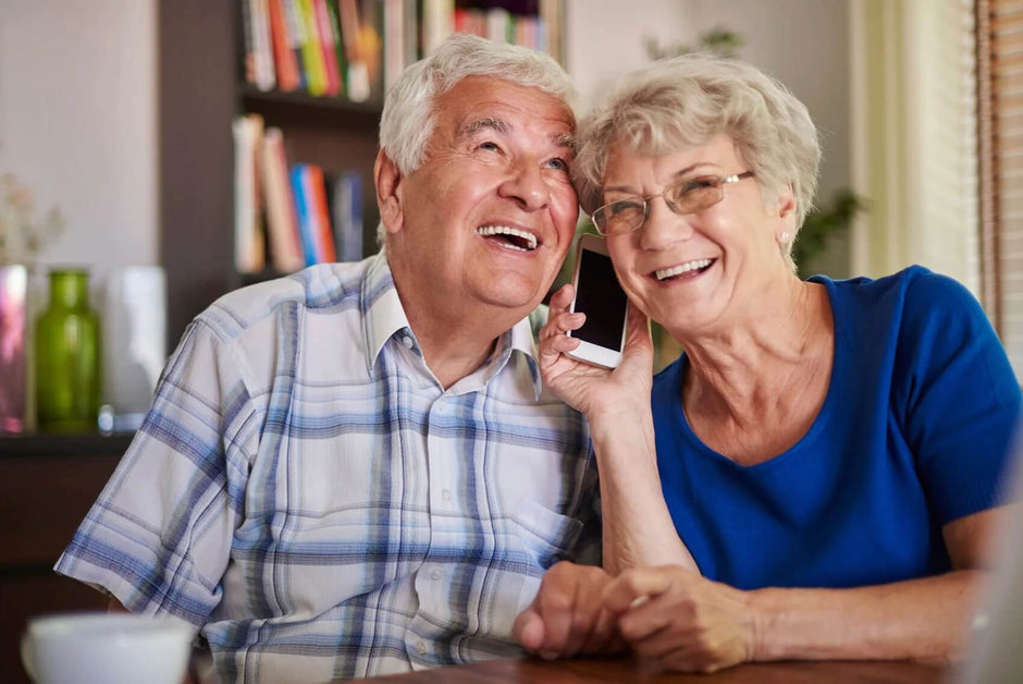 Hearing problems - couple holding telephone